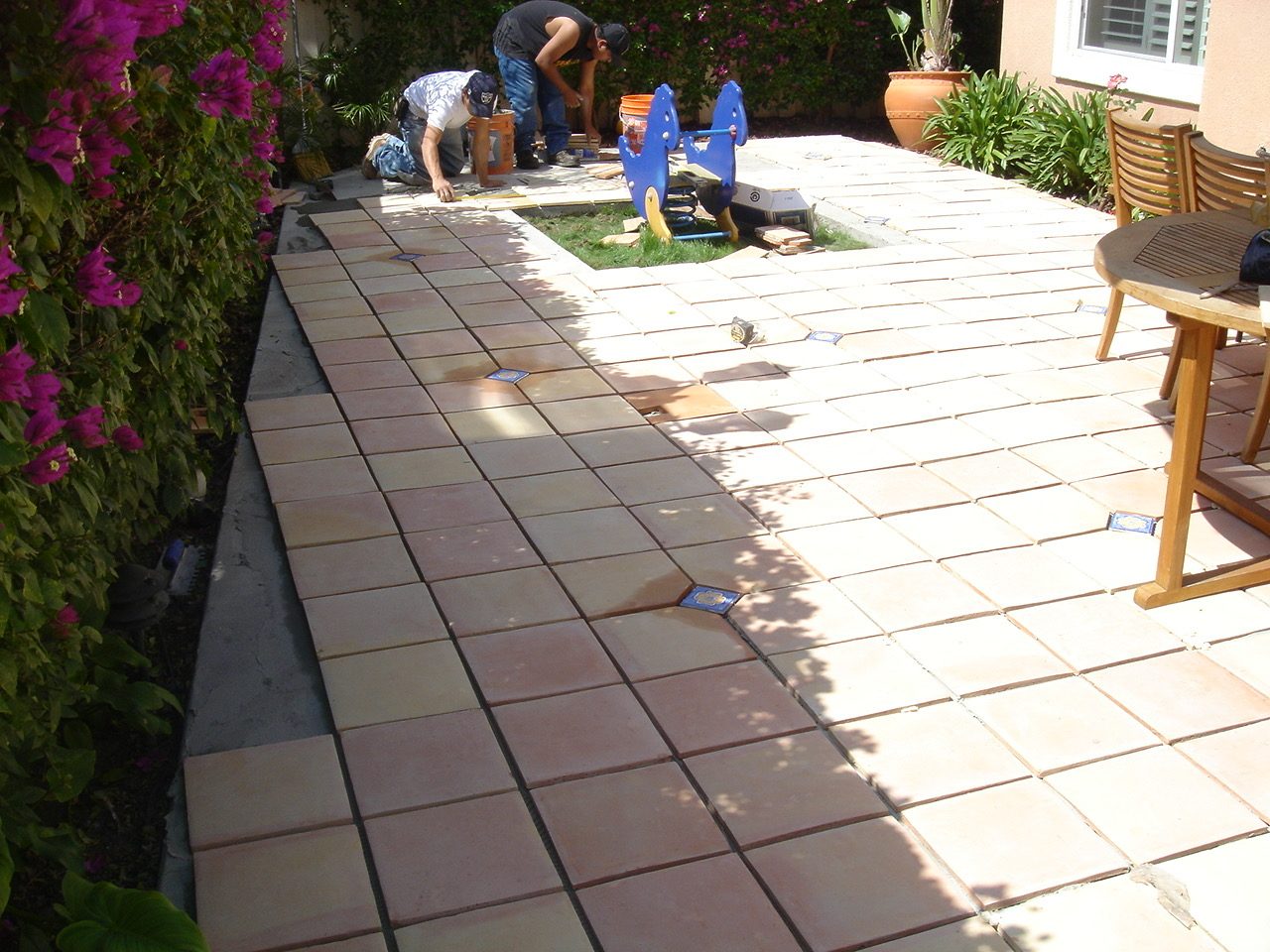Custom terracotta patio tilework with decorative accent tiles